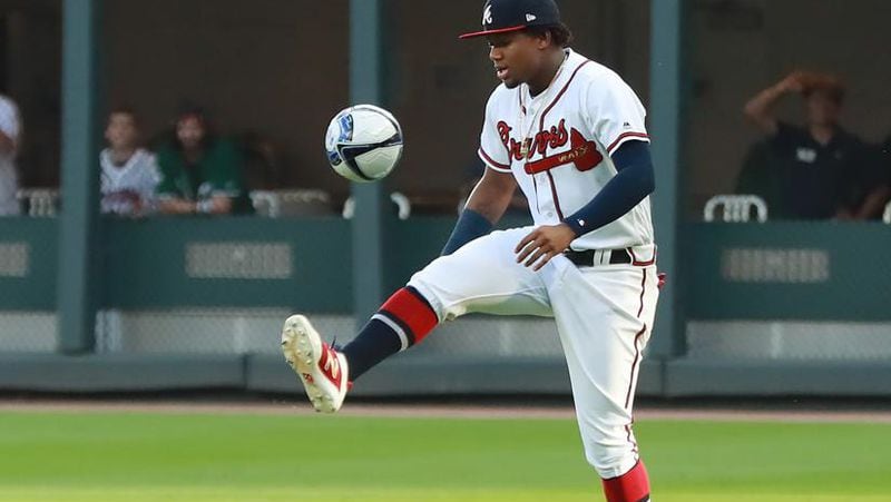 Braves' Ronald Acuna kicks around a soccer ball in the outfield while the team recognizes the Atlanta United team for winning the MLS Cup on Wednesday, April 17, 2019, at SunTrust Park in Atlanta. Curtis Compton/ccompton@ajc.com