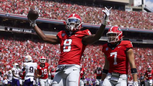 Georgia wide receiver Colbie Young (8) celebrates after scoring a six-yard touchdown reception during the first quarter against Tennessee Tech at Sanford Stadium, Saturday, Sept. 7, 2024, in Athens, Ga. The Bulldogs won 48-3.  (Jason Getz / AJC)
