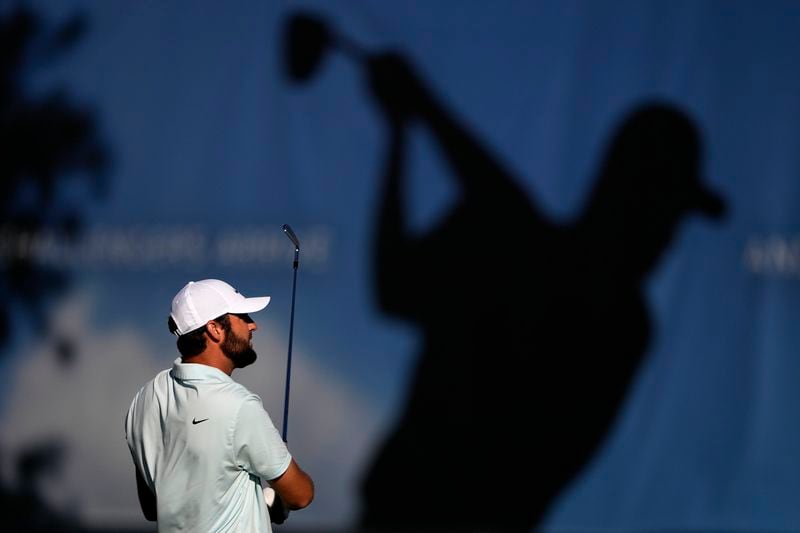 Scottie Scheffler hits on the driving range prior to the third round of the BMW Championship golf event at Castle Pines Golf Club, Saturday, Aug. 24, 2024, in Castle Rock, Colo. (AP Photo/Matt York)