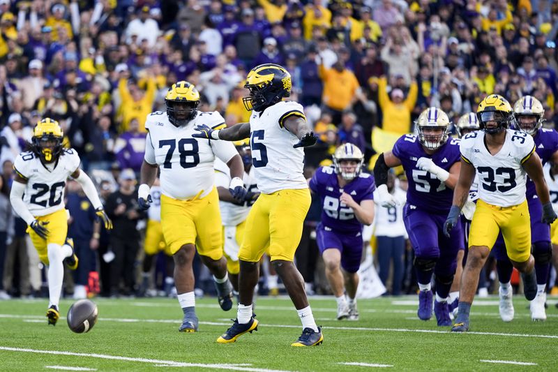 Michigan linebacker Ernest Hausmann (15) reacts after his team blocked a field goal attempt by Washington place kicker Grady Gross during the first half of an NCAA college football game Saturday, Oct. 5, 2024, in Seattle. (AP Photo/Lindsey Wasson)