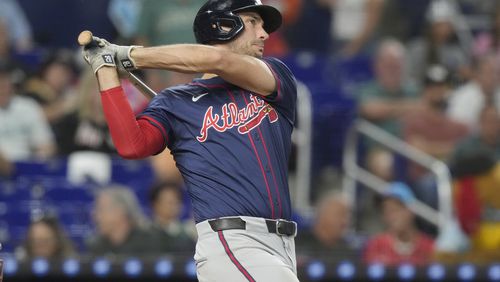 Atlanta Braves' Matt Olson hits a two-run home run during the seventh inning of a baseball game against the Miami Marlins, Saturday, Sept. 21, 2024, in Miami. (AP Photo/Marta Lavandier)