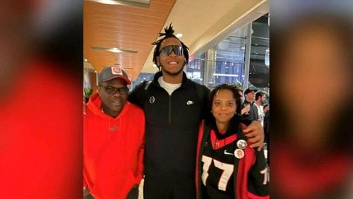 Devin Willock (center) with his parents, Dave and Sharlene Willock.