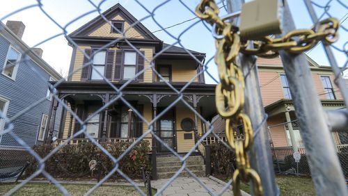 A fence surrounds the birth home of the Rev. Martin Luther King Jr. located at 501 Auburn Avenue NE, in Atlanta (shown here on Thursday, Jan. 11, 2024) after bystanders thwarted an arson attempt a month ago. The National Park Service has been working to secure the historic site while also keeping it accessible to the public. (John Spink / John.Spink@ajc.com)