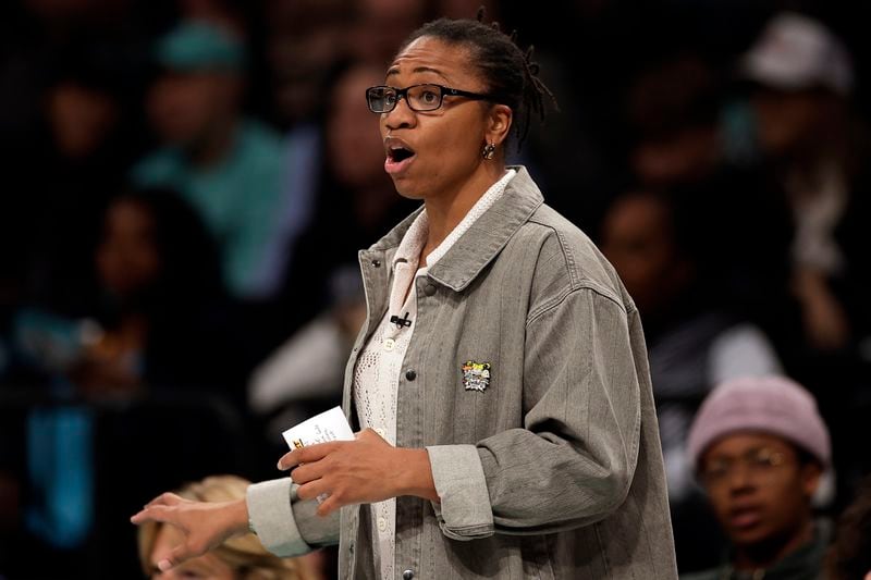 Atlanta Dream head coach Tanisha Wright reacts during the first half of a first-round WNBA basketball playoff game against the New York Liberty, Tuesday, Sept. 24, 2024, in New York. (AP Photo/Adam Hunger)