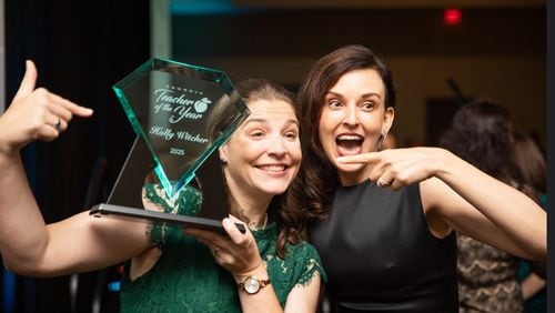 White County teacher Holly Witcher (left) celebrates being named Georgia Teacher of the Year on May 31 with the current title holder Christy Todd of Fayette County. (Courtesy of the Georgia Department of Education)