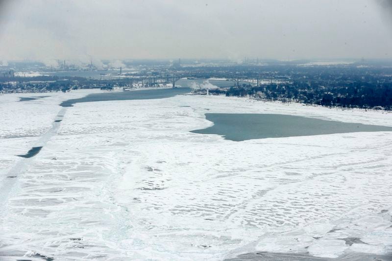 FILE - Lake Huron is shown, looking south towards Port Huron, Mich., right, and Sarnia, Ontario, left, Feb. 6, 2014. (AP Photo/Carlos Osorio, File)