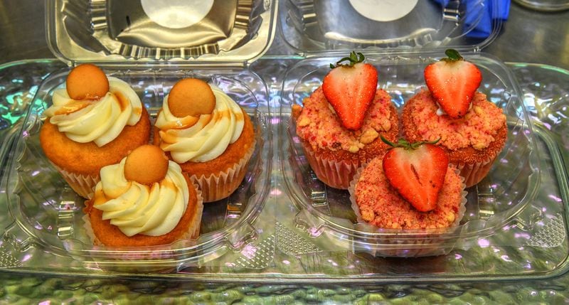 Cakes by Keon, which has a store located off Candler Road just south of I-20 in Decatur, now also has a presence at the New Black Wall Street Market in Stonecrest. Shown here are Banana Pudding (left) and Strawberry Shortcake cupcakes. (Chris Hunt for The Atlanta Journal-Constitution)