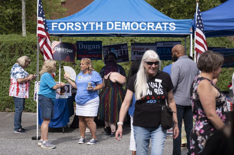 Democrats gather for the opening of a campaign office in Cumming on Sunday, where Kentucky Gov. Andy Beshear campaigned for Vice President Kamala Harris.