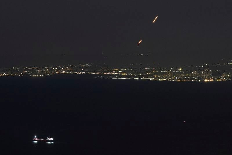 Israeli Iron Dome air defense system fires to intercept rockets that were launched from Lebanon, as seen from Haifa, northern Israel, Thursday, Sept. 26, 2024. (AP Photo/Baz Ratner)