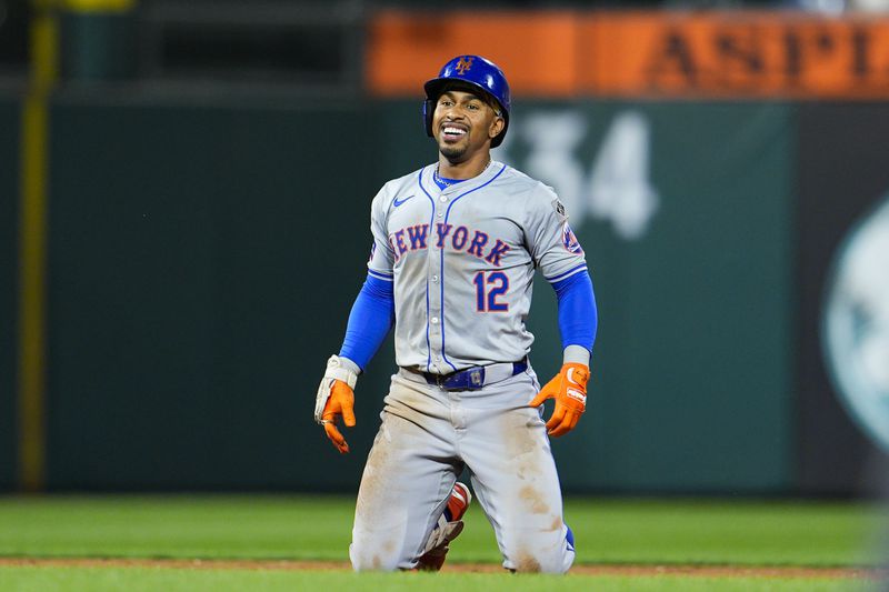 New York Mets' Francisco Lindor smiles after he was tagged out by Philadelphia Phillies' Trea Turner while trying to advance to third base during the sixth inning of a baseball game, Friday, Sept. 13, 2024, in Philadelphia. (AP Photo/Derik Hamilton)