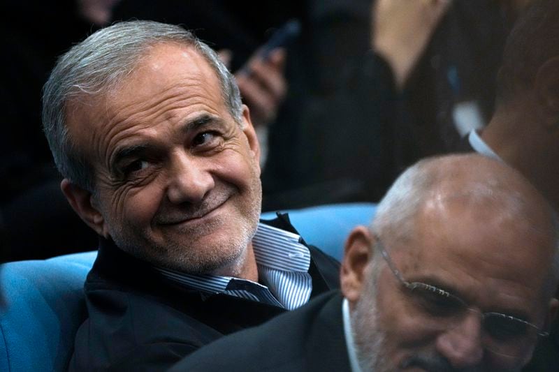 Iranian President Masoud Pezeshkian sits as he arrives at his press conference in Tehran, Iran, Monday, Sept. 16, 2024. (AP Photo/Vahid Salemi)