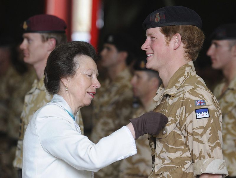 Britain's Princess Anne, left, presents Prince Harry with his campaign medal, in Windsor, England, Monday May 5, 2008. The 23-year-old Prince, known as Lieutenant Wales, is among around 160 members of the Household Cavalry who served in Afghanistan this winter to receive the decoration. (AP Photo/John Stillwell, pool)