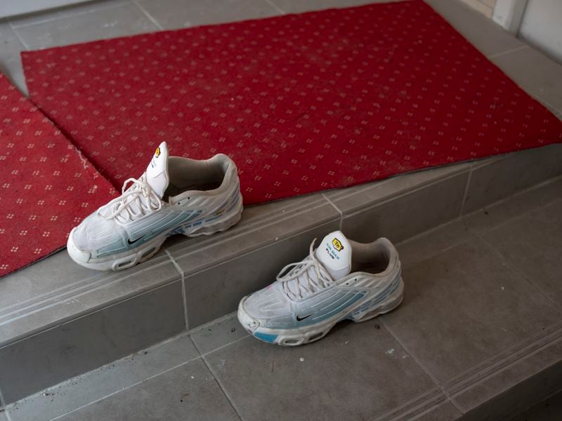 A student's shoes sit outside the entrance to the mosque at Ibn Khaldoun, a private Muslim school, in Marseille, southern France, Tuesday, April 16, 2024. (AP Photo/Daniel Cole)
