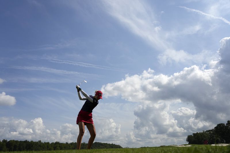 United States' Nelly Korda hits on the 12th hole during a Solheim Cup golf tournament fourball match at Robert Trent Jones Golf Club, Friday, Sept. 13, 2024, in Gainesville, Va. (AP Photo/Matt York)