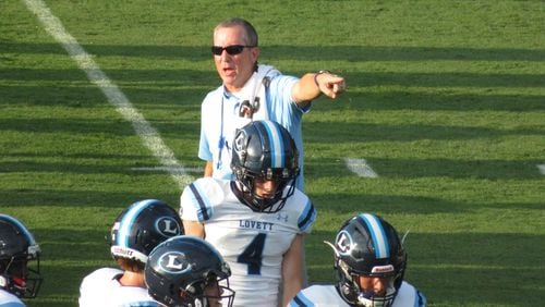 File: Lovett Lions coach Mike Muschamp directs his team during their pregame routine before their matchup at Westminster School in Atlanta on Aug. 20, 2021. (Adam Krohn for the AJC)