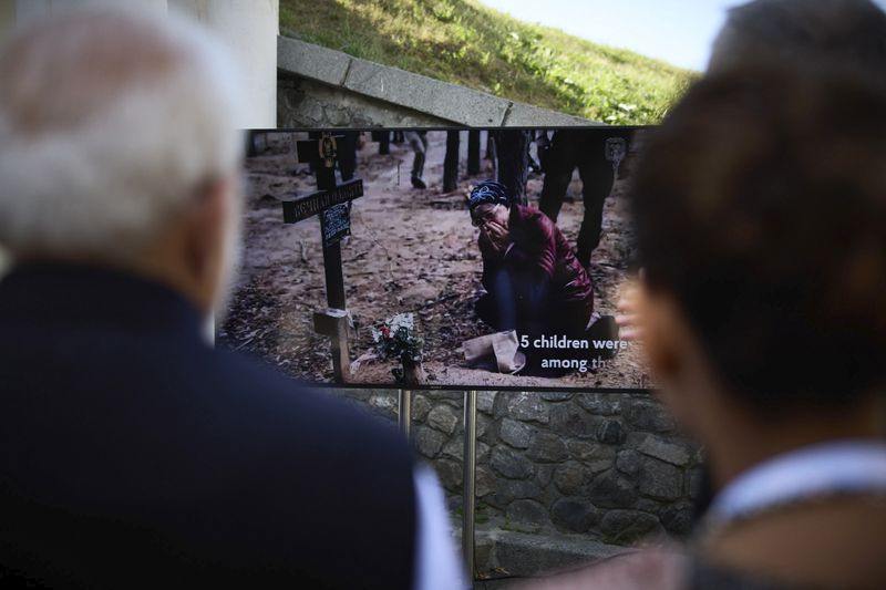 In this photo provided by the Ukrainian Presidential Press Office, shows Indian Prime Minister Narendra Modi, left, and Ukrainian President Volodymyr Zelenskyy during their visit to the memorial commemorating hundreds of Ukrainian children who were killed over more than two years of the war in Kyiv, Ukraine, Friday, Aug. 23, 2024. (Ukrainian Presidential Press Office via AP)