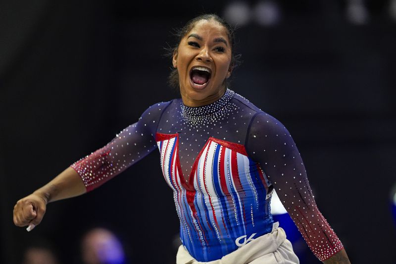 Jordan Chiles celebrates as day two of competition winds down at the United States Gymnastics Olympic Trials on Sunday, June 30, 2024, in Minneapolis. (AP Photo/Abbie Parr)
