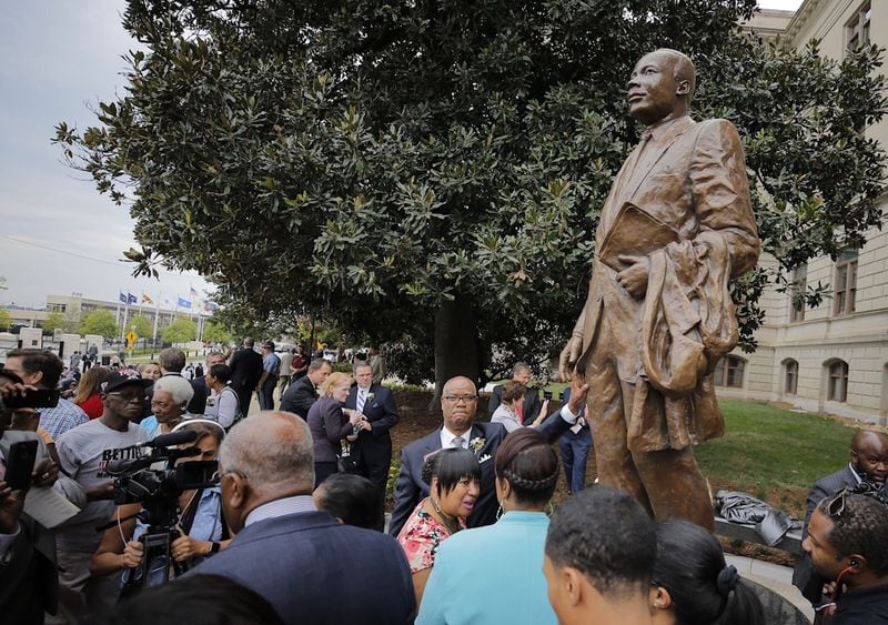 Georgia leaders, including Gov. Nathan Deal, Sandra Deal, and members of the King family, unveiled the first statue of Martin Luther King Jr. on Monday at the statehouse grounds, more than three years after Gov. Nathan Deal first announced the project. During the hour-long ceremony leading to the unveiling of the statue of Martin Luther King Jr. at the state Capitol on Monday, many speakers, including Gov. Nathan Deal, spoke of King’s biography. The statue was unveiled on the anniversary of King’s famed “I Have Dream” speech. 