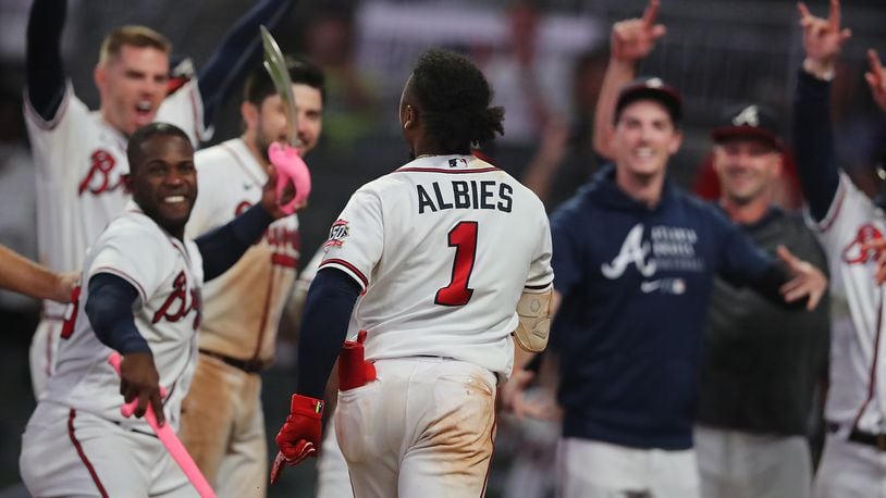 Albies' 3-run homer in the 8th gives the Braves a 4-2 victory over the  Brewers