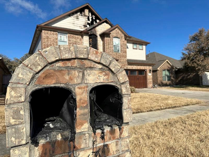 A mailbox melted by the heat of a pipeline fire sits in front of a home in Deer Park, Texas, on Thursday, Sept. 19, 2024. (AP Photo/Juan A. Lozano)