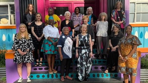 Curator Lisa Tuttle (top row, right) and ArtsXchange founder Alice Lovelace-Riley (bottom row, second from left) with some of the artists in the cultural center's group exhibit “A Room of Her Own: Women Studio Artists from AXC’s 40-Year History."