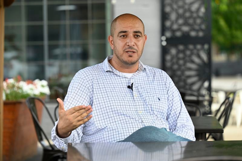 Uncommitted delegate to the Democratic National Convention Abbas Alawieh answers questions during an interview Wednesday, Aug. 14, 2024, in Dearborn, Mich. (AP Photo/Jose Juarez)