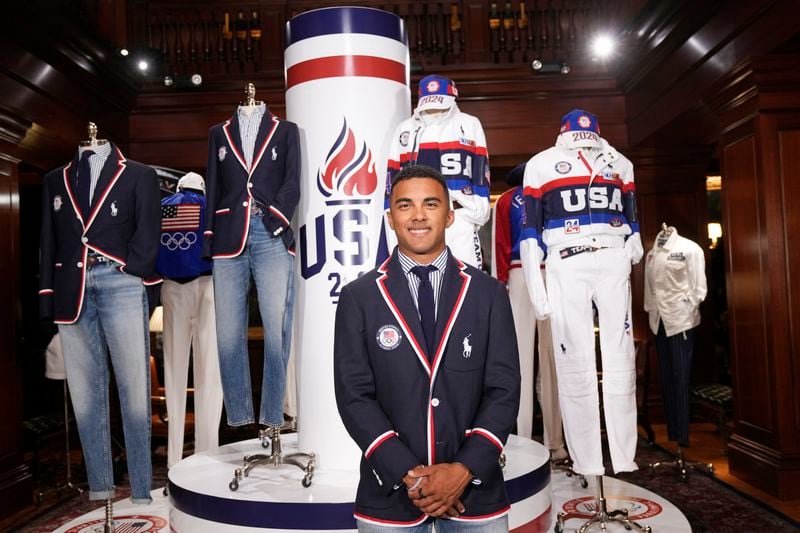 Olympic athlete in BMX racing, Kamren Larsen, models the Team USA Paris Olympics opening ceremony uniform at Ralph Lauren headquarters on Monday, June 17, 2024, in New York. (Photo by Charles Sykes/Invision/AP)