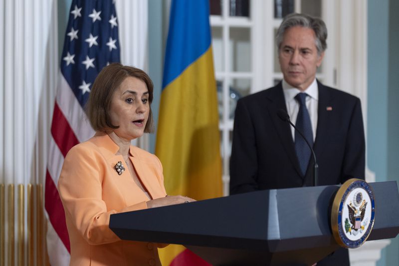 Romanian Foreign Minister Luminița-Teodora Odobescu, left, with Secretary of State Antony Blinken, speaks during a ceremony in the Treaty Room at the State Department, Friday, June 21, 2024, in Washington. (AP Photo/Manuel Balce Ceneta)