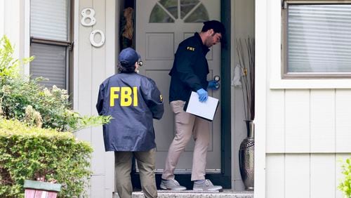 FBI agents raid a home on Maiden Lane where Oakland Mayor Sheng Thao allegedly lives in Oakland, Calif. Thursday, June 20, 2024. Federal authorities raided a home belonging to Oakland Mayor Sheng Thao early Thursday as part of an investigation that included a search of at least two other houses, authorities said. (Jessica Christian/San Francisco Chronicle via AP)