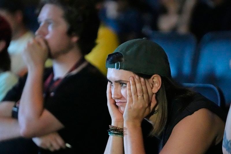 Sara Day, a supporter of President Joe Biden, watches coverage of the debate between Biden and former President Donald Trump, at Brewvies Cinema Pub on Thursday, June 27, 2024, in Salt Lake City. (AP Photo/Rick Bowmer)