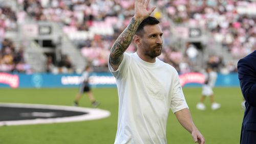 Inter Miami forward Lionel Messi waves as he walks off the field after being honored for his 45 career trophies before an MLS soccer match against the Chicago Fire, Saturday, July 20, 2024, in Fort Lauderdale, Fla. (AP Photo/Lynne Sladky)