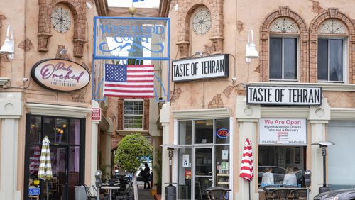 The Pink Orchid bakery and cafe and the Taste of Tehran restaurant are seen in the so-called "Tehrangeles" neighborhood in the Westwood district of Los Angeles on Monday, May 20, 2024. (AP Photo/Damian Dovarganes)
