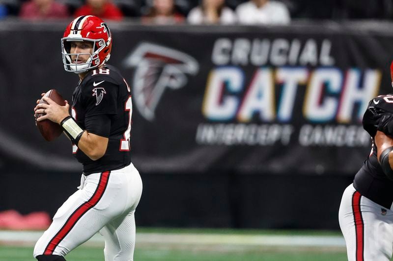 Atlanta Falcons quarterback Kirk Cousins (18) works in the pocket against the New Orleans Saints during the first half of an NFL football game, Sunday, Sept. 29, 2024, in Atlanta. (AP Photo/Butch Dill)