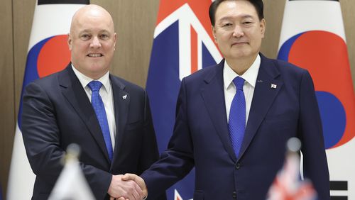 South Korean President Yoon Suk Yeol, right, shakes hands with New Zealand's Prime Minister Christopher Luxon during a meeting at the Presidential Office in Seoul, South Korea, Wednesday, Sept. 4, 2024. (Jin Sung-chul/Yonhap via AP)