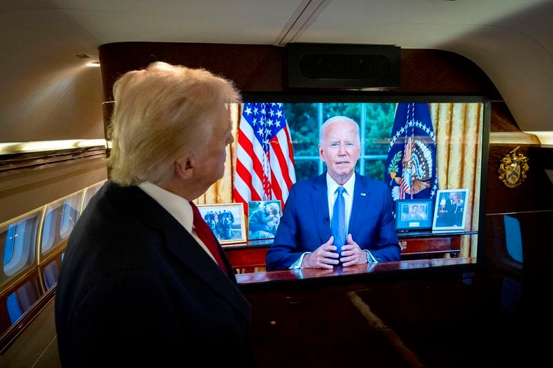 While aboard his plane following a rally in North Carolina, former President Donald Trump watches President Joe Biden address the nation on Wednesday.