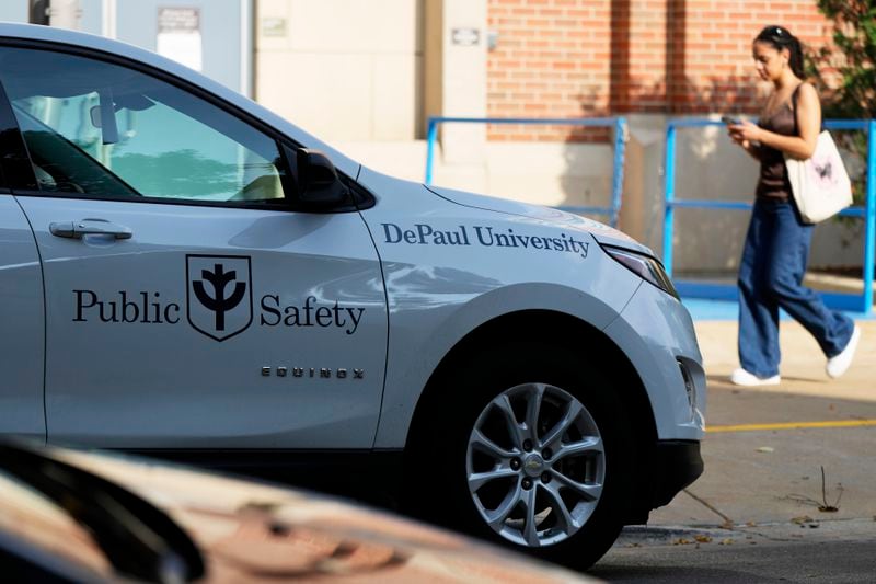 A Public Safety vehicle parks on the street at DePaul University in Chicago, Wednesday, Aug. 28, 2024. (AP Photo/Nam Y. Huh)