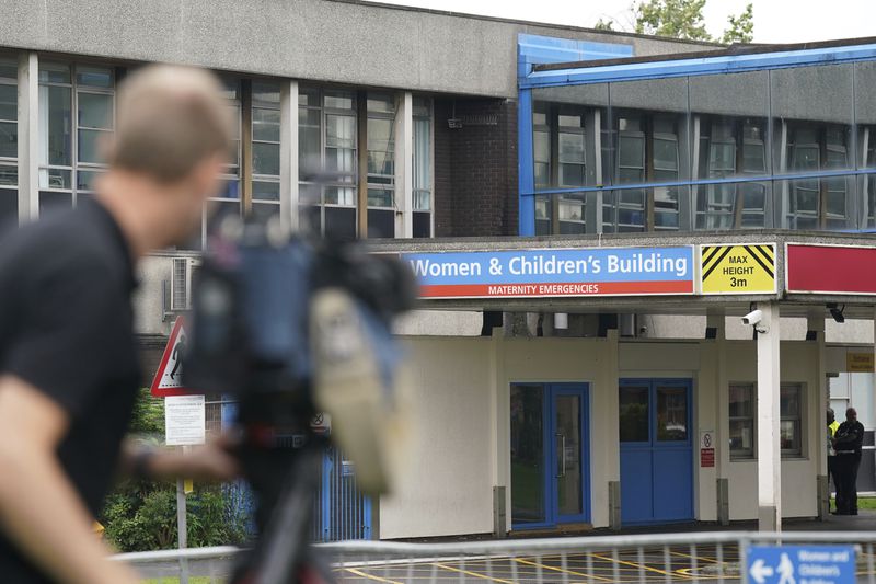 FILE - Members of the media outside the Countess of Chester Hospital in Chester, England, Friday, Aug. 18, 2023. (Jacob King/Pool Photo via AP, File)