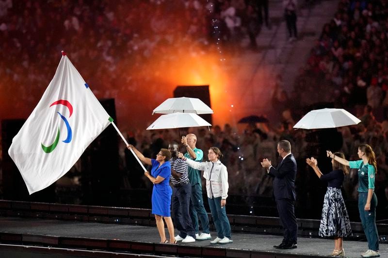 Mayor of Los Angeles Karen Bass holds the Paralympic flag during the closing ceremony of the 2024 Paralympics, Sunday, Sept. 8, 2024, in Paris, France. (AP Photo/Thibault Camus)