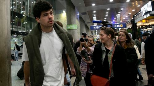 French rugby player Hugo Auradou arrives from Mendoza to the airport in Buenos Aires, Argentina, Tuesday, Aug. 27, 2024. He and teammate Oscar Jegou were arrested following charges of sexual assault after France played Argentina in Mendoza on July 6. (AP Photo/Virginia Chaile)