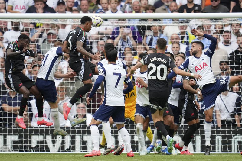 Arsenal's Gabriel scores the opening goal during the English Premier League soccer match between Tottenham Hotspur and Arsenal in London, Sunday, Sept. 15, 2024. (AP Photo/Kin Cheung)