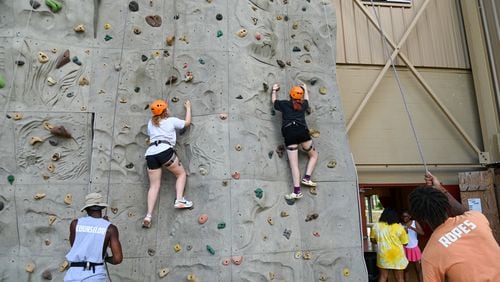 Campers climb the rock wall at a recent session of Camp Kudzu for kids and teens with Type 1 diabetes. Jennie Clayton/Special to the AJC