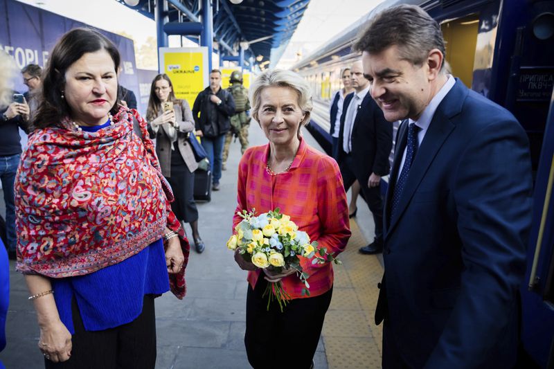 President of the European Commission, Ursula von der Leyen, center, is greeted as she arrives at the railway station in Kyiv, Ukraine, Friday, Sept. 20, 2024. (Christoph Soeder, Pool via AP)