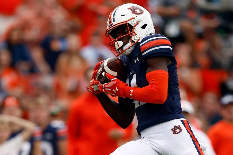 Auburn wide receiver Malcolm Simmons catches a pass for a touchdown during the first half of an NCAA college football game against Oklahoma, Saturday, Sept. 28, 2024, in Auburn, Ala. (AP Photo/Butch Dill)