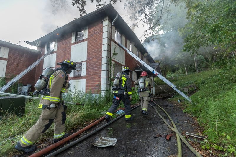 A large fire broke out early Monday morning, July 1, 2024 at a vacant apartment building in northwest Atlanta on Neal Place in the Bankhead neighborhood, according to spokesperson Anaré Holmes. “Crews had to attack the flames defensively from the outside of the building,” Holmes said. No injuries were reported. (John Spink/AJC)