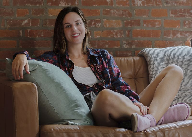 Kendra King sits on her sofa in her home in Philadelphia on July 26, 2024. (Deenah J. Leh via AP)