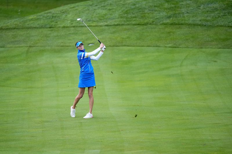 Europe's Esther Henseleit hits from the second fairway during a Solheim Cup golf tournament foursomes match at Robert Trent Jones Golf Club, Friday, Sept. 13, 2024, in Gainesville, VA. (AP Photo/Chris Szagalo)