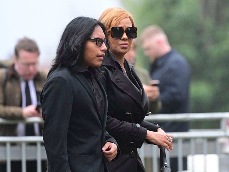 Yaniseth Alcides, right, the partner of Swedish soccer manager Sven-Goran Eriksson arrives at his funeral service at Fryksände church in Torsby, Sweden, Friday Sept. 13, 2024. (Jonas Ekströmer/TT News Agency via AP)