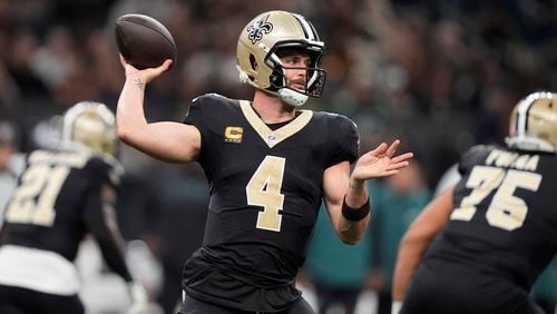 New Orleans Saints quarterback Derek Carr (4) passes against the Philadelphia Eagles in the first half of an NFL football game in New Orleans, Sunday, Sept. 22, 2024. (AP Photo/Gerald Herbert)