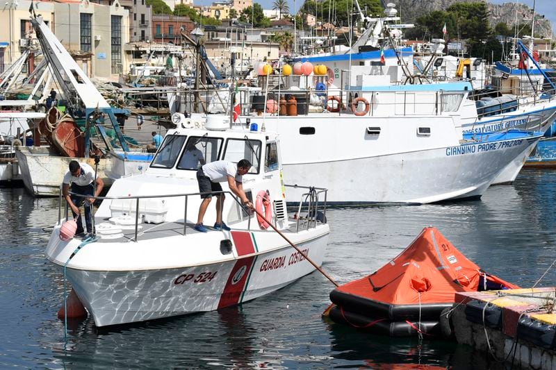 A life boat is docked at the harbor of Porticello, southern Italy, Tuesday, Aug. 20, 2024. Rescue teams and divers returned to the site of a storm-sunken superyacht Tuesday to search for six people, including British tech magnate Mike Lynch, who are believed to be still trapped in the hull 50 meters (164-feet) underwater. (AP Photo/Salvatore Cavalli)