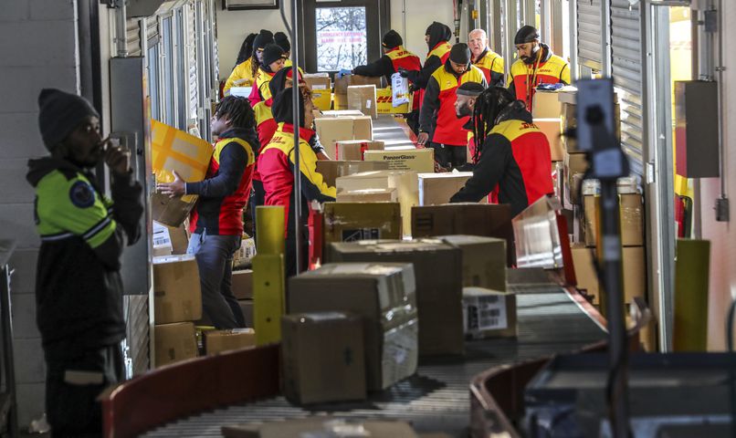 December 15, 2022 ATLANTA: DHL Express handles international shipments to and from the U.S., and station services Ray Aylward said he has seen about a 15% bump up in package volume for the peak holiday period compared with the rest of the year. (John Spink / John.Spink@ajc.com)

